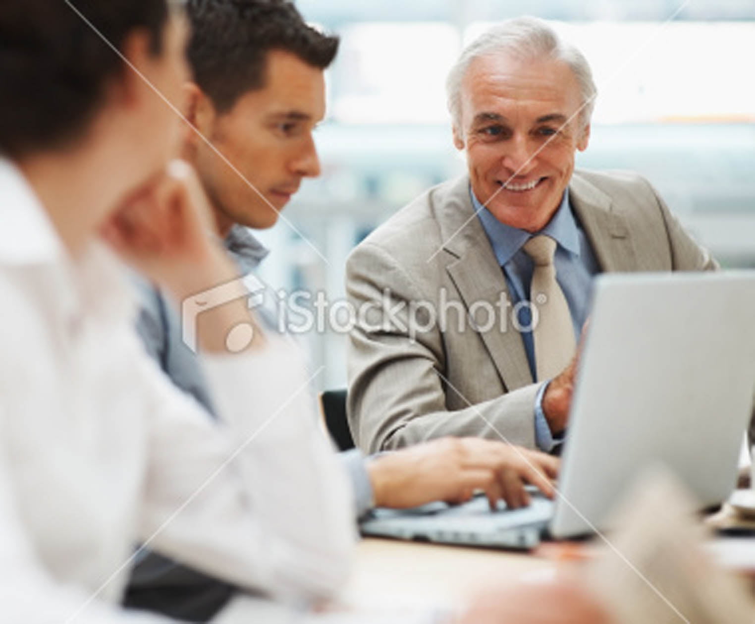 stock-photo-12479975-successful-business-group-with-a-laptop-in-meeting ...